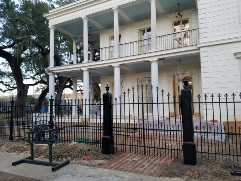 Custom wrought iron fence and swing rntry gate with custom victorian metal posts