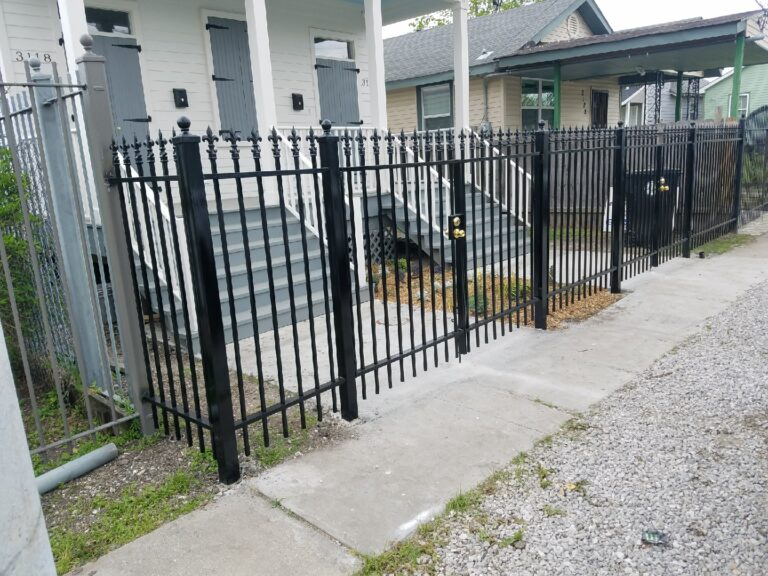 wrought iron fence and wrought iron pedestrian gate