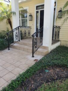 Custom wrought iron front steps and porch railings
