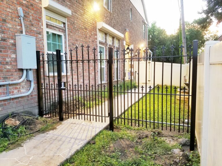 arched custom wrought iron side gate with fence panels