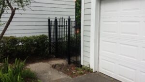 custom wrought iron side arched gate wih wrought iron side fence panels