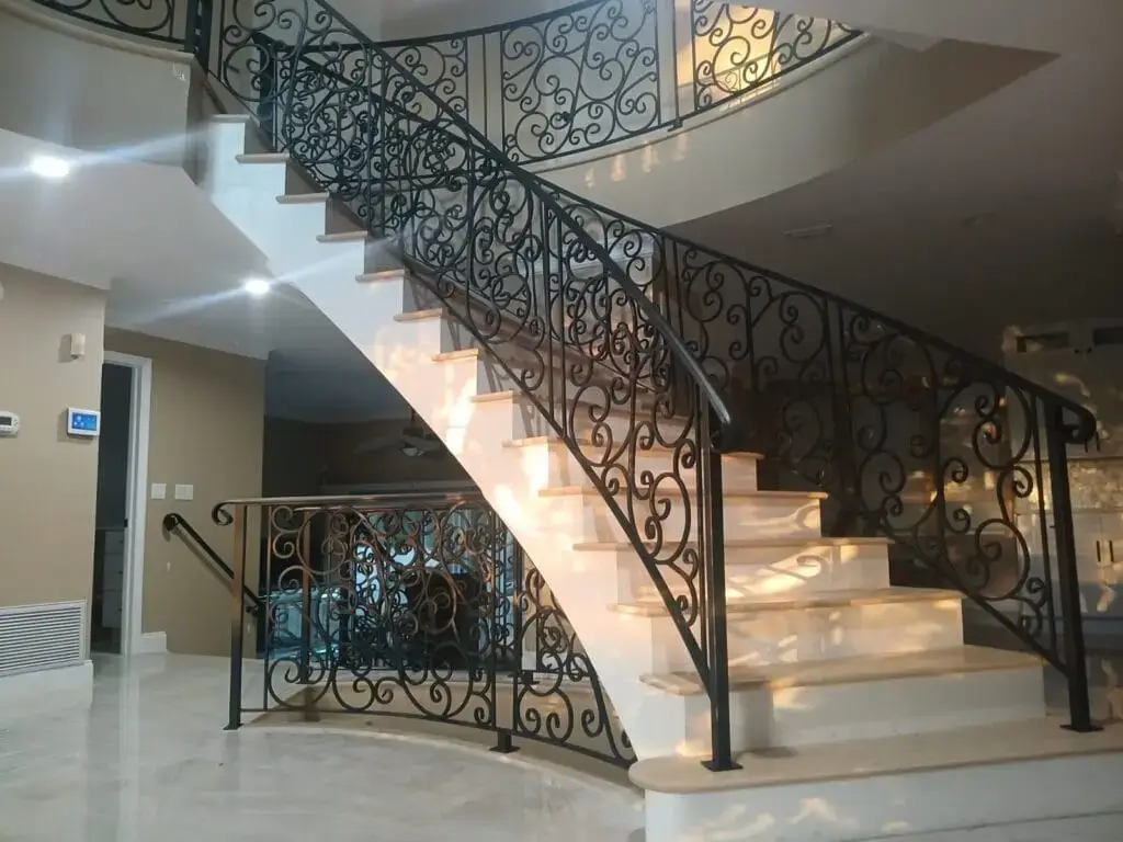 Custom ornamental interior staircase and balcony wrought iron railing