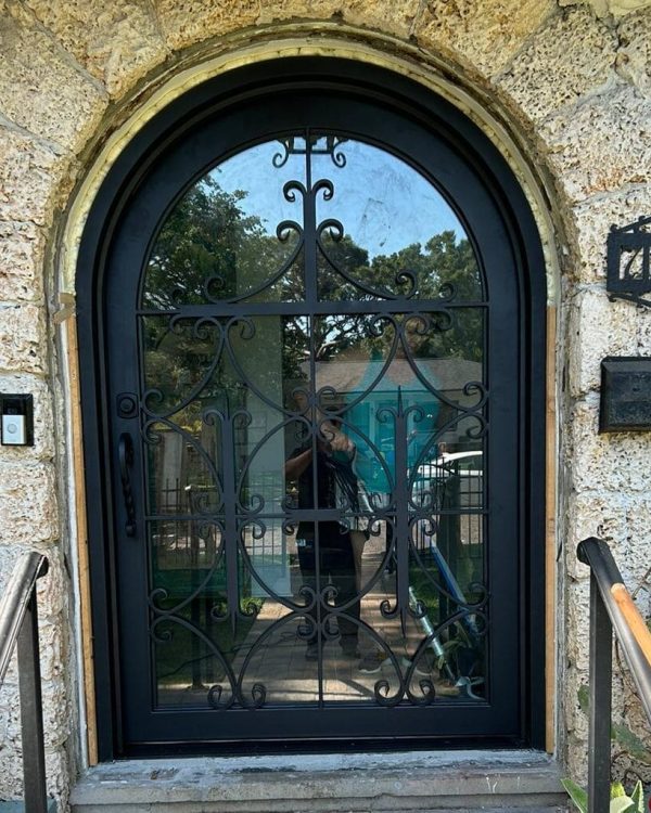 Custom arch top ornamental wrought iron front door